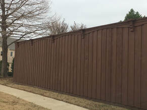 Wooden fence with metal post